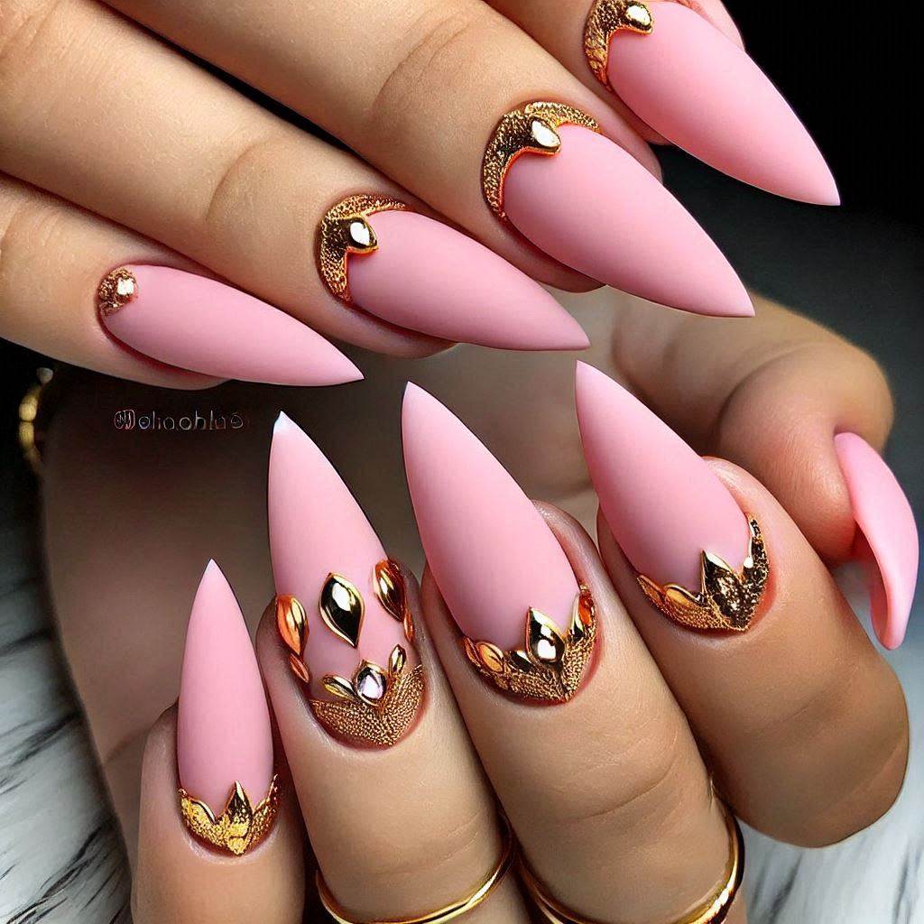 Matte pink almond nails with gold accents